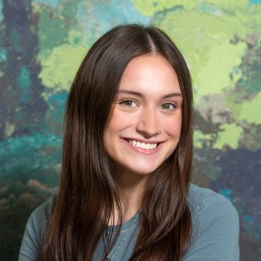 Headshot of Claire J., receptionist at Aris Clinic.