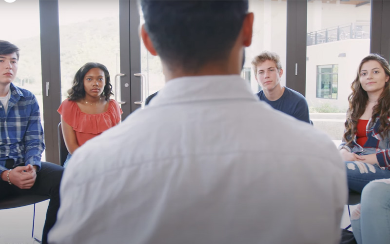 Teens meeting for group mental health therapy.