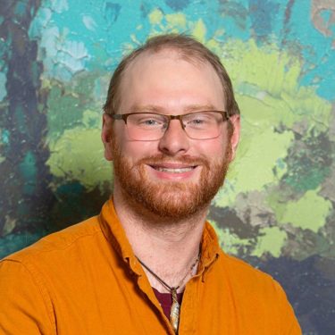 Headshot of Zach Johnson., psychotherapist at Aris Clinic.