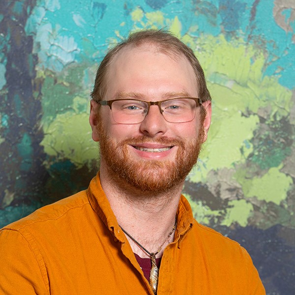 Headshot of Zach Johnson., psychotherapist at Aris Clinic.