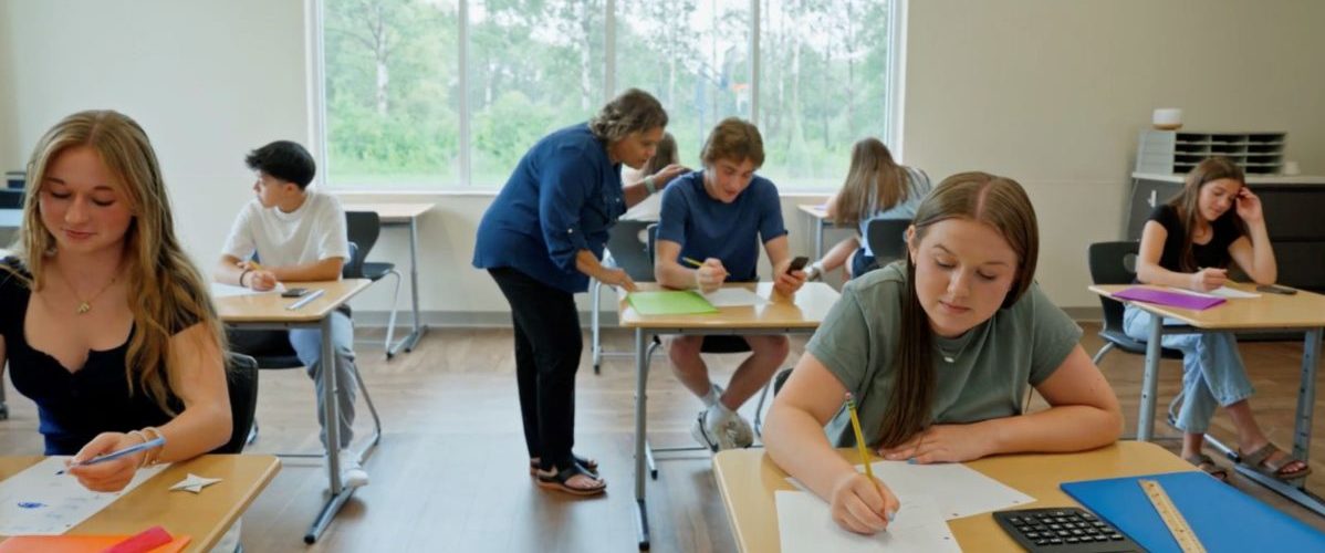 Teens working on school work as a part of the educational component of the children's mental health program at Aris Clinic.